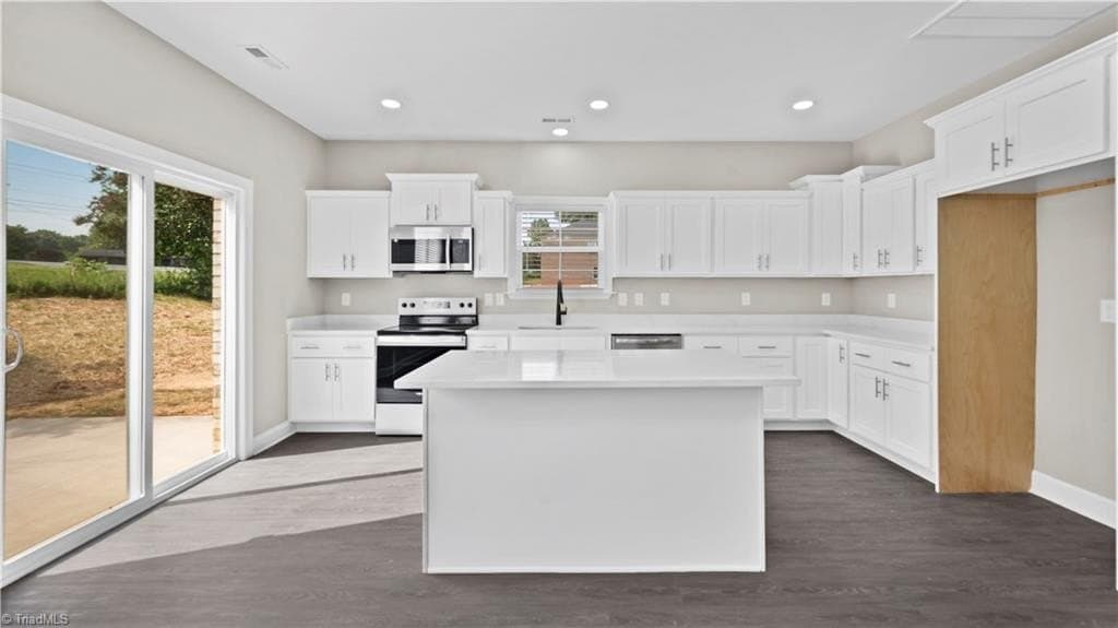 Chef's kitchen with quartz counters and slider doors